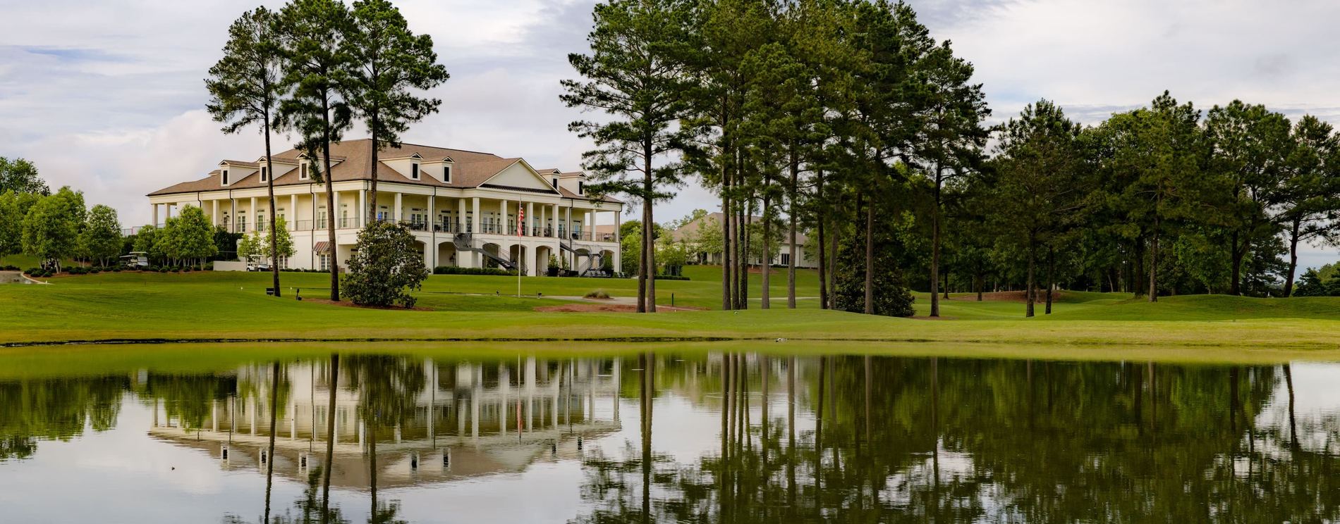 The Reunion clubhouse reflected in the lake