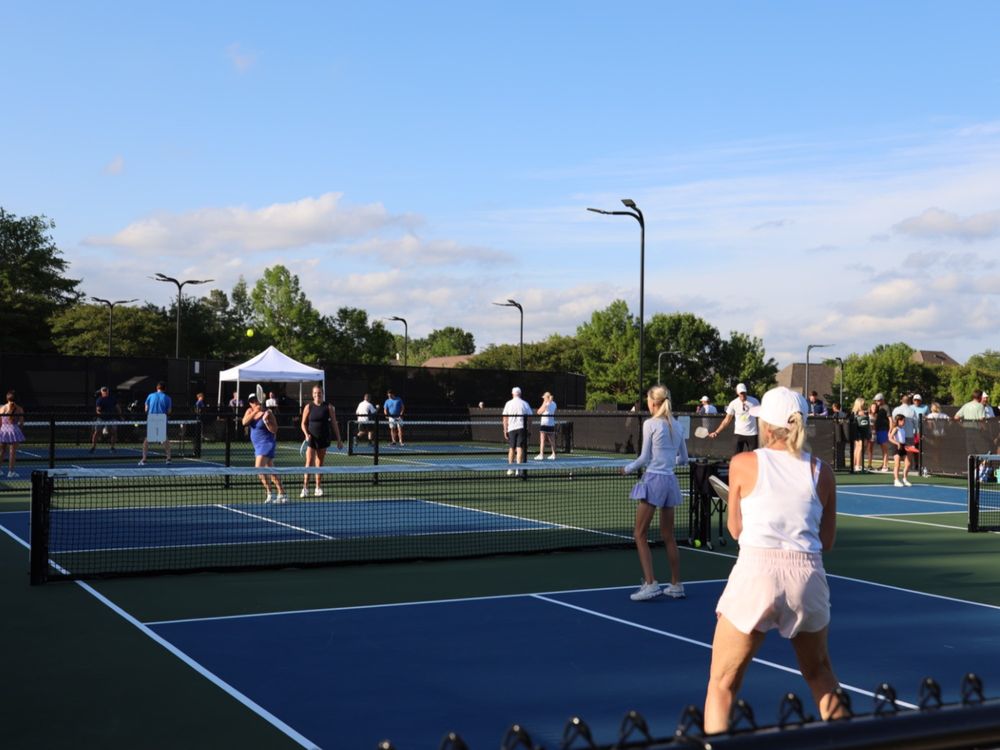 Members playing on the courts at Reunion